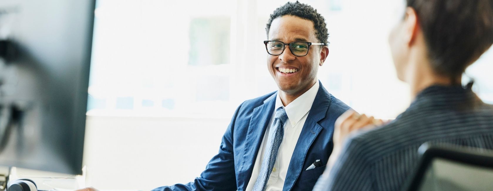 Businessman in discussion with coworker